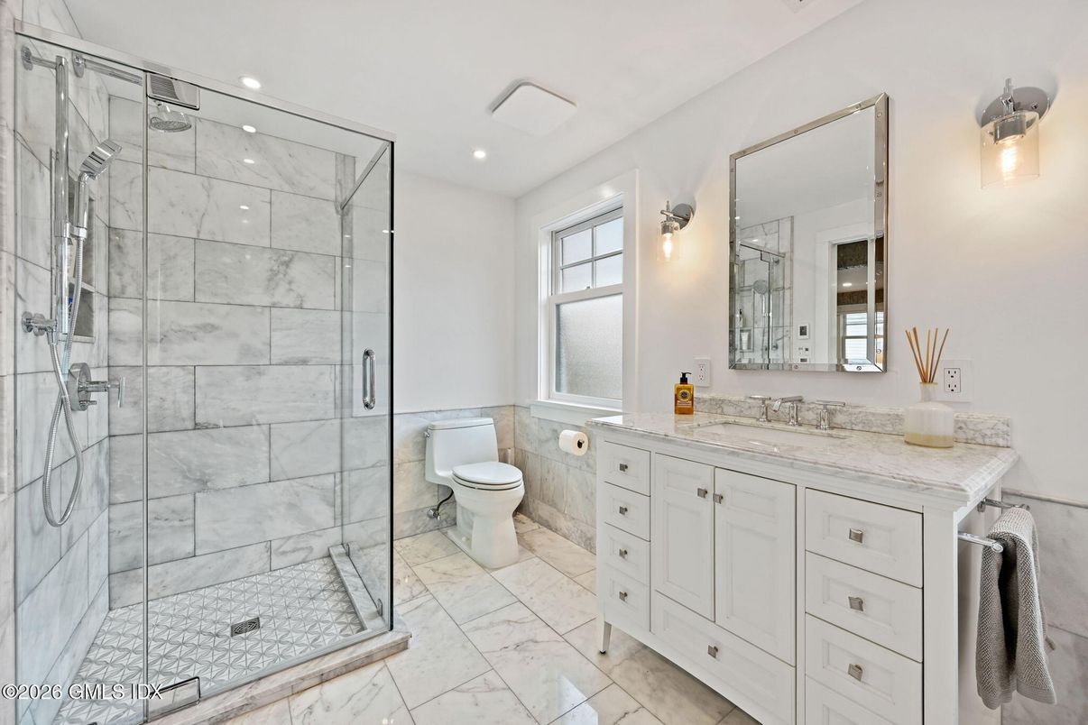 Bathroom, Dual Sink Vanities, Glass Shower, Interior, Marble, Marble Walls, Recessed Lighting
