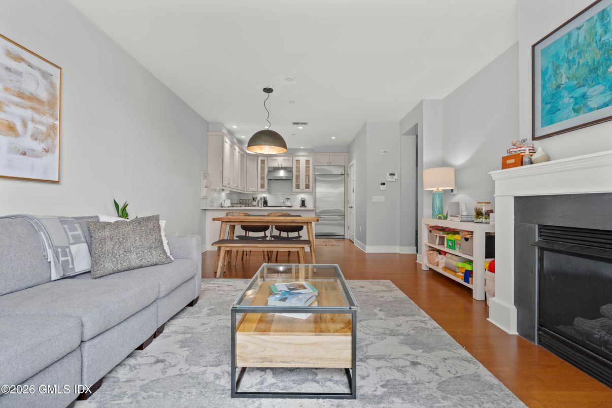 Fireplace, Interior, Kitchen, Living room, Pendant Lights, Recessed Lighting, Stainless Steel Appliances, Wood Texture Flooring