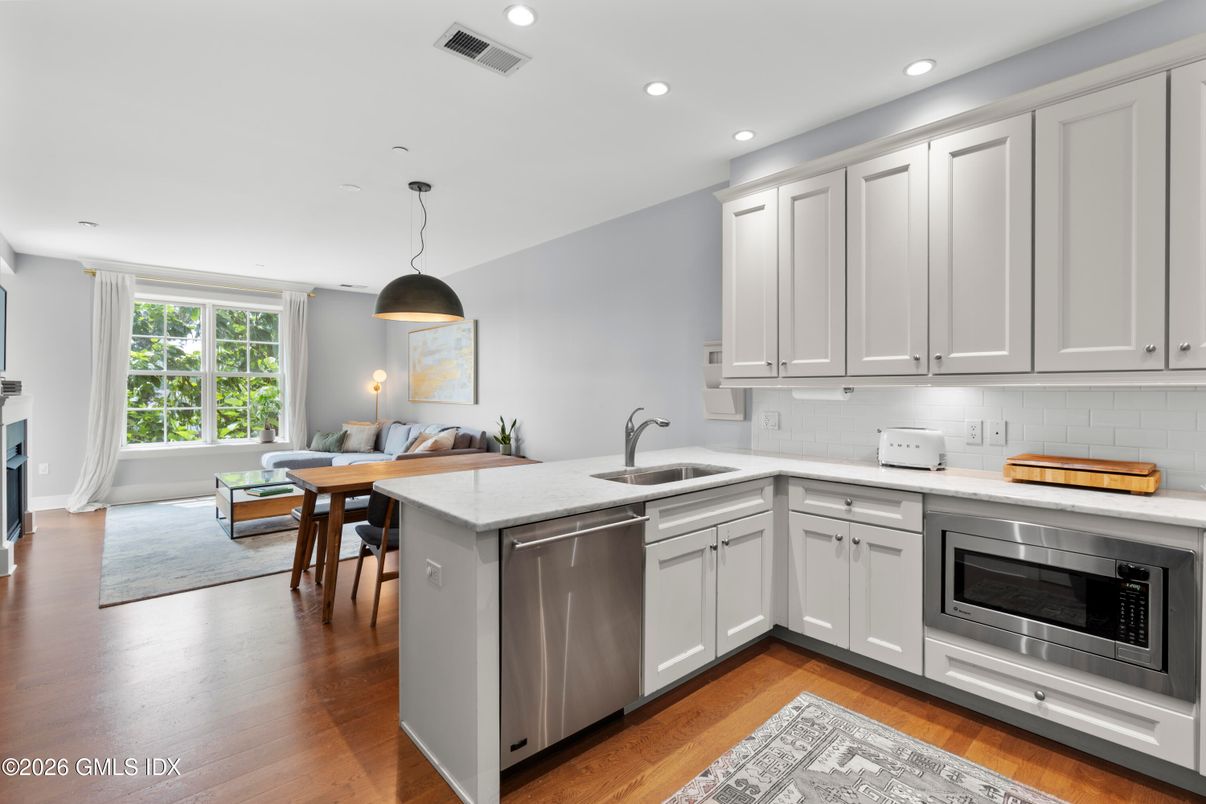 Dining room, Interior, Kitchen, Pendant Lights, Recessed Lighting, Stainless Steel Appliances, Wood Texture Flooring