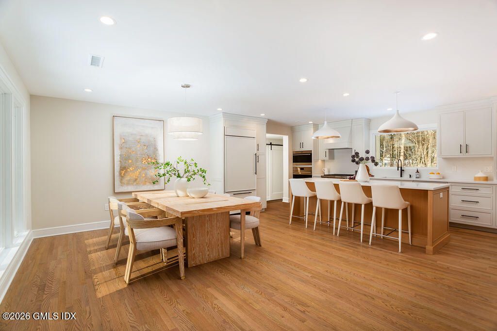 Dining room, Interior, Kitchen, Pendant Lights, Recessed Lighting, Stainless Steel Appliances, Wood Texture Flooring