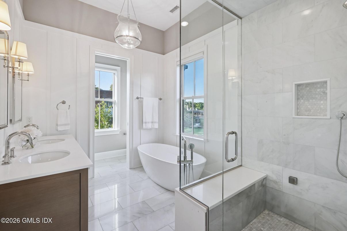 Bathroom, Dual Sink Vanities, Free Standing Baths, Glass Shower, Interior, Marble, Marble Walls, Pendant Lights, Recessed Lighting