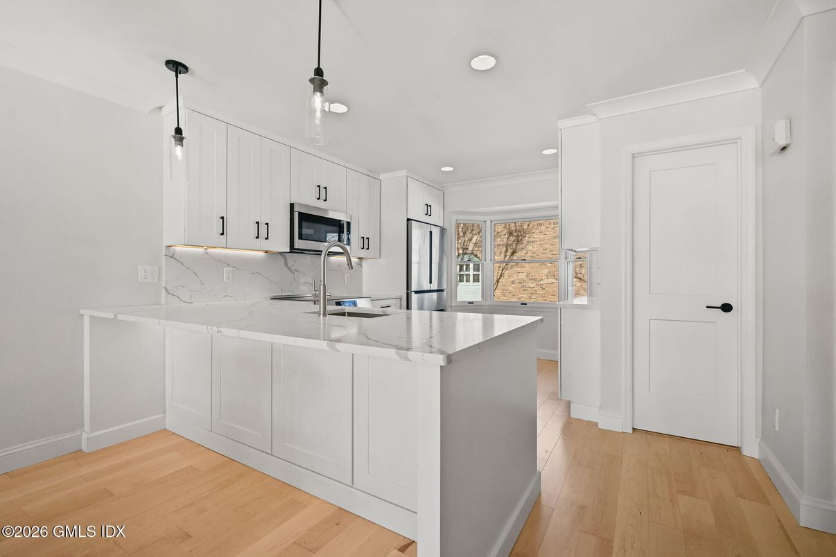 Interior, Kitchen, Marble Walls, Pendant Lights, Recessed Lighting, Wood Texture Flooring