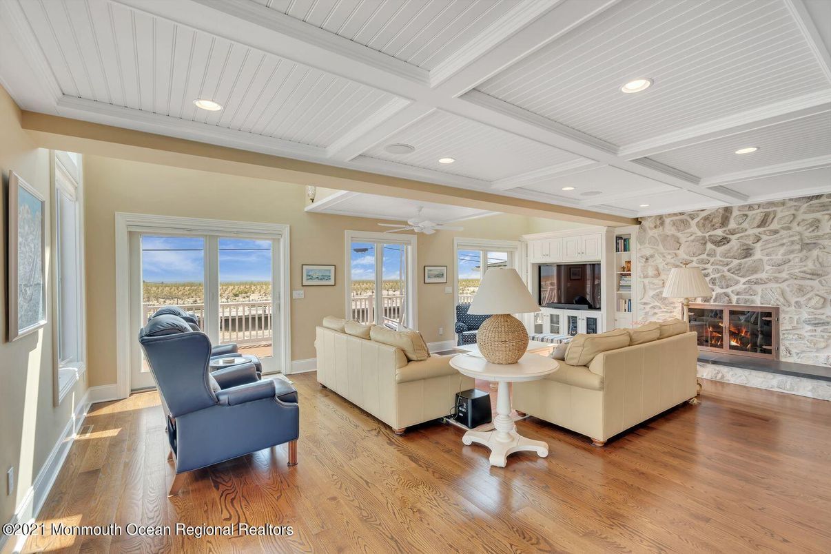 Fireplace, Interior, Living room, Recessed Lighting, Stone Walls, Wood Texture Flooring