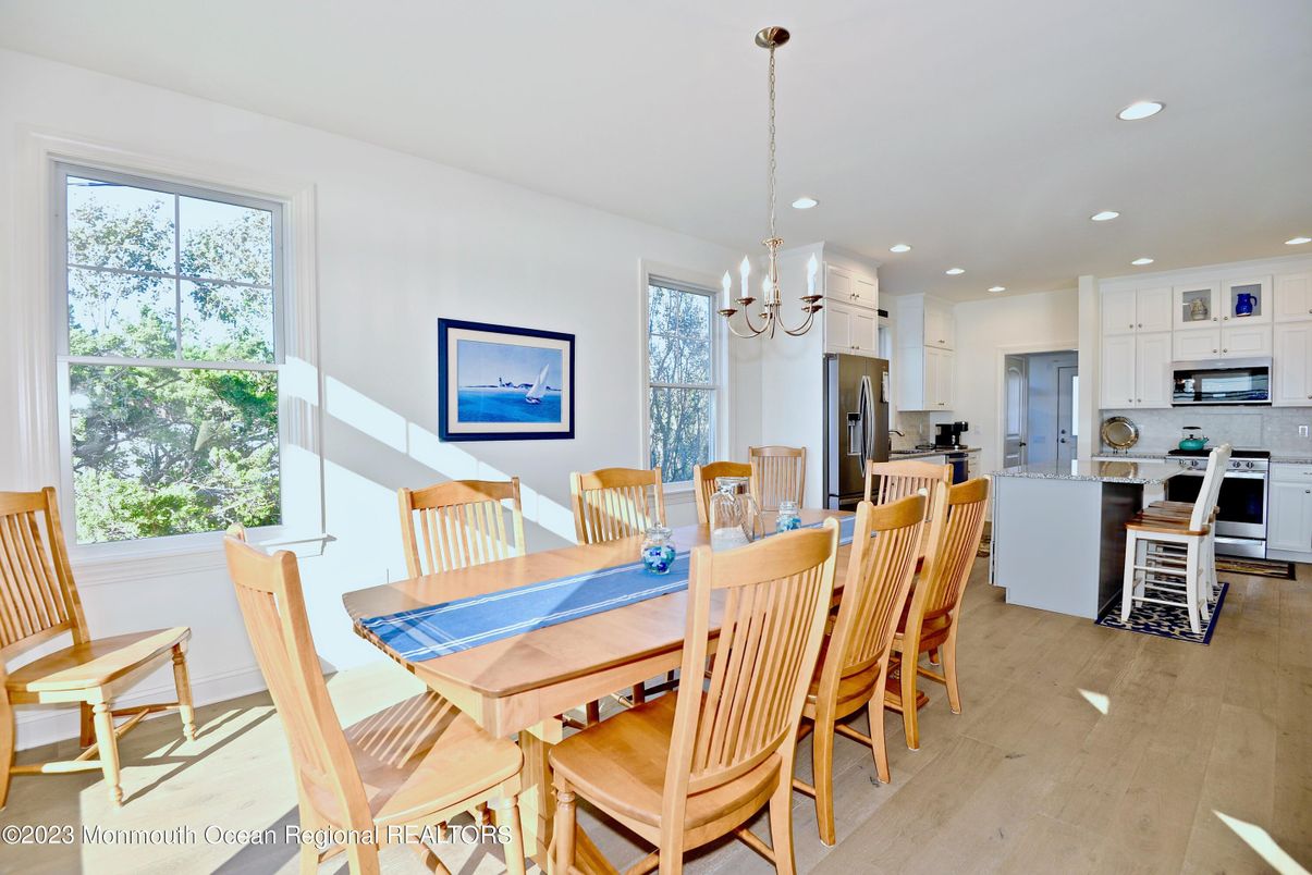Chandelier, Dining room, Interior, Kitchen, Recessed Lighting, Stainless Steel Appliances, Wood Texture Flooring