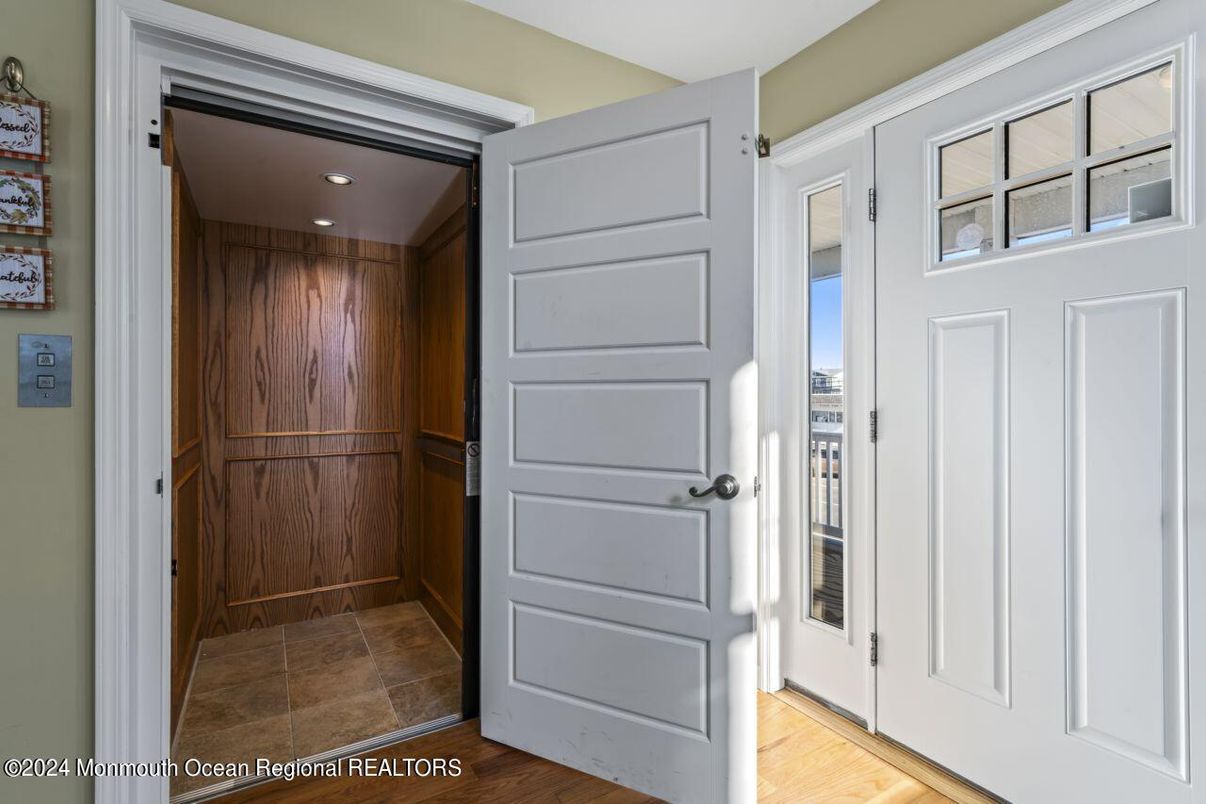 Elevator, Interior, Recessed Lighting, Wood Texture Flooring, Wooden Walls