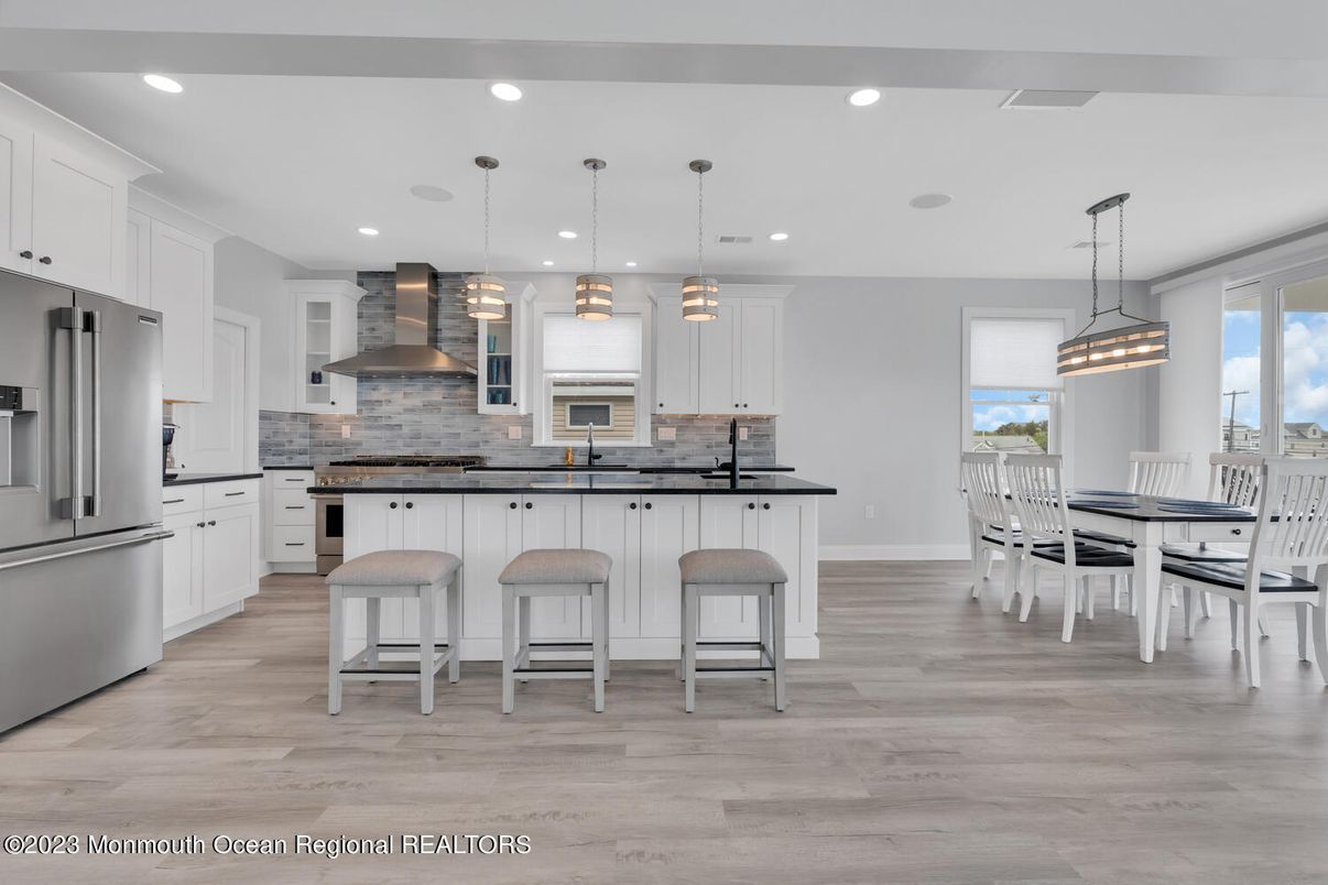 Dining room, Interior, Kitchen, Pendant Lights, Recessed Lighting, Stainless Steel Appliances, Wood Texture Flooring