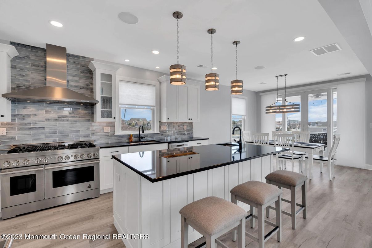 Dining room, Interior, Kitchen, Pendant Lights, Recessed Lighting, Stainless Steel Appliances, Wood Texture Flooring
