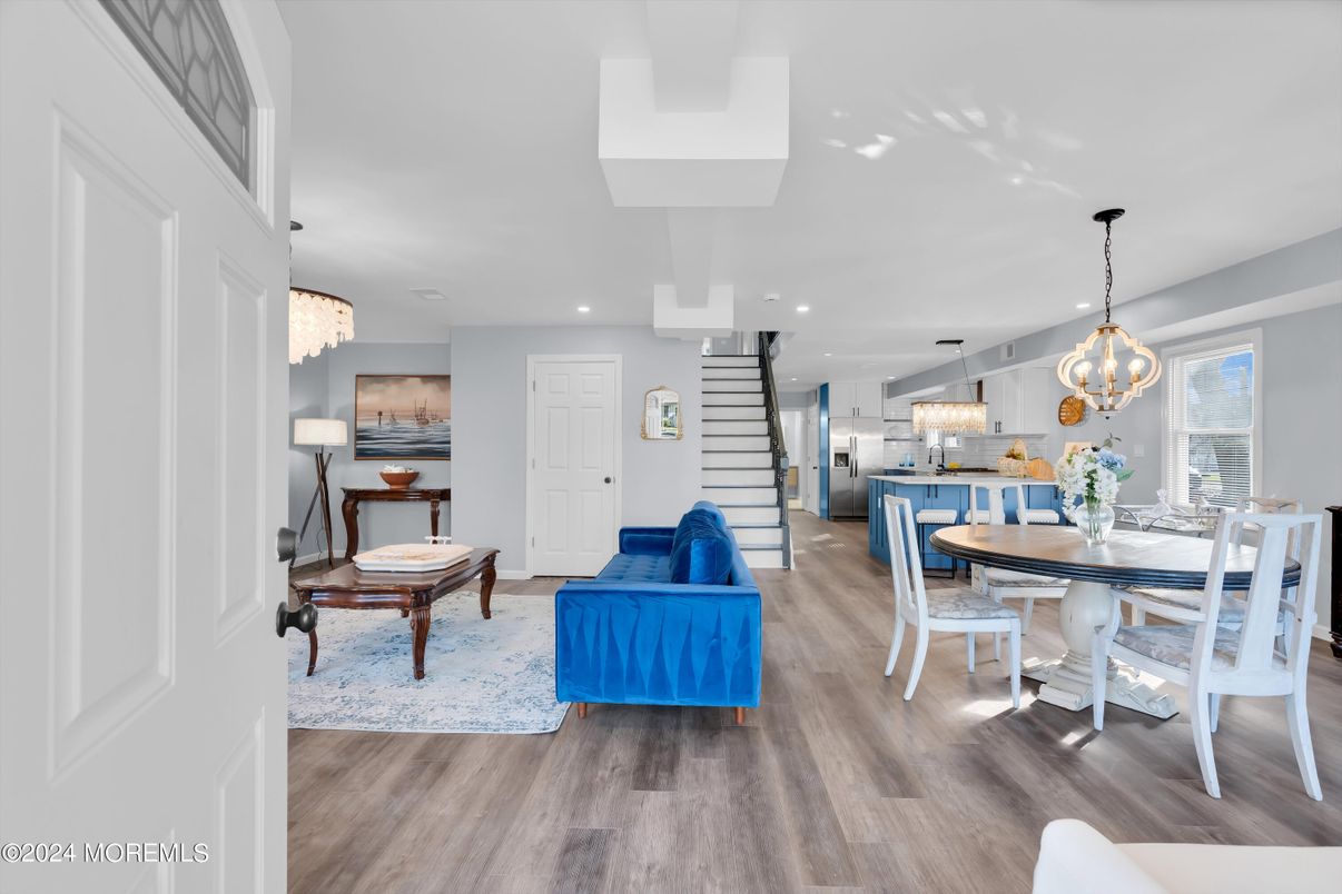 Chandelier, Dining room, Interior, Kitchen, Living room, Pendant Lights, Recessed Lighting, Stainless Steel Appliances, Wood Texture Flooring