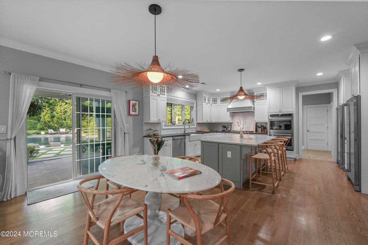 Dining room, Interior, Kitchen, Pendant Lights, Recessed Lighting, Stainless Steel Appliances, Wood Texture Flooring