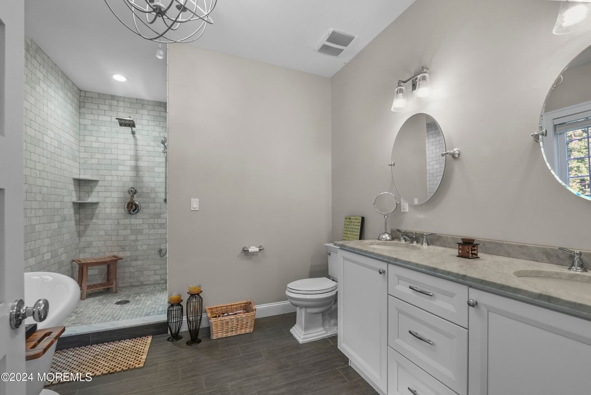 Bathroom, Dual Sink Vanities, Glass Shower, Interior, Recessed Lighting, Wood Texture Flooring