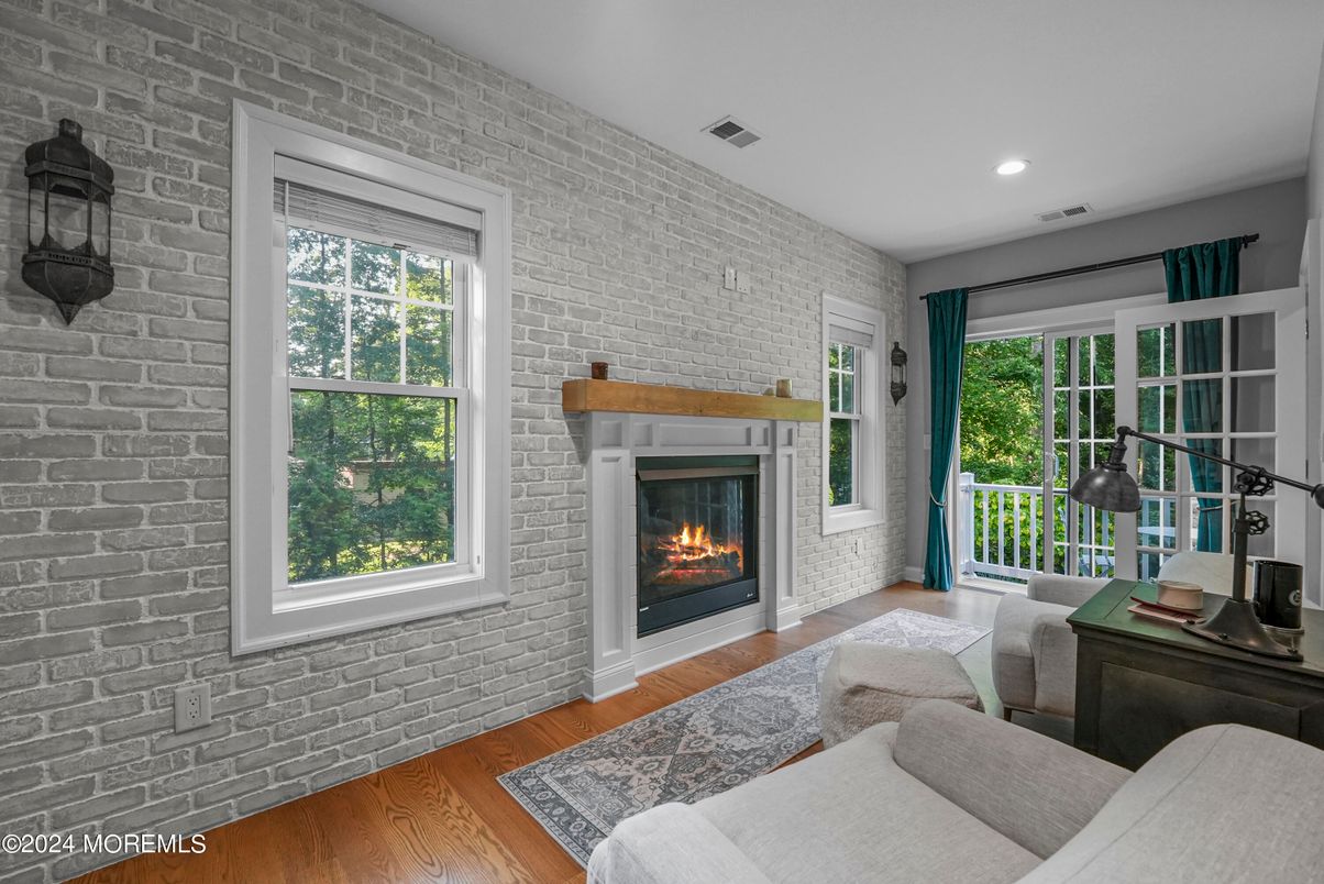 Fireplace, Interior, Living room, Recessed Lighting, Stone Walls, Wood Texture Flooring