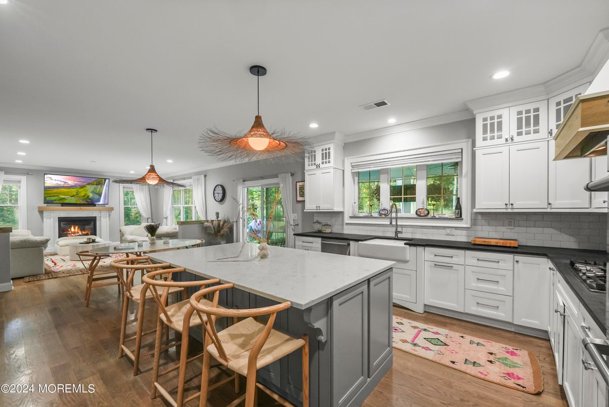 Dining room, Fireplace, Interior, Kitchen, Living room, Pendant Lights, Recessed Lighting, Wood Texture Flooring