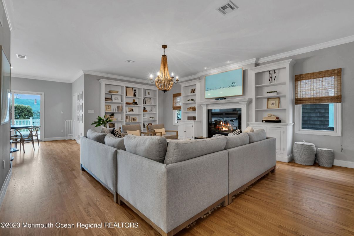 Chandelier, Dining room, Fireplace, Interior, Living room, Recessed Lighting, Wood Texture Flooring