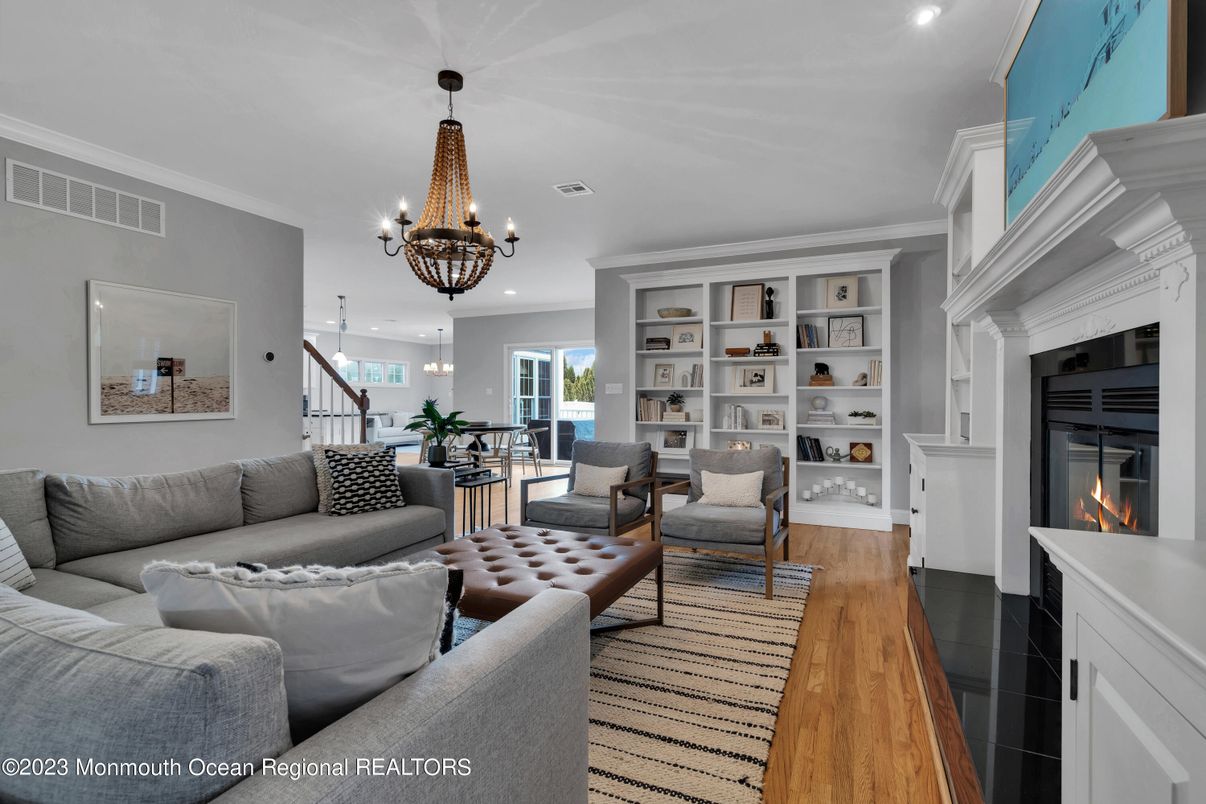 Chandelier, Fireplace, Interior, Living room, Recessed Lighting, Wood Texture Flooring