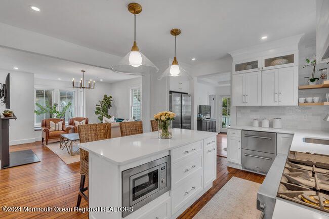 Dining room, Interior, Kitchen, Living room, Pendant Lights, Recessed Lighting, Stainless Steel Appliances, Wood Texture Flooring
