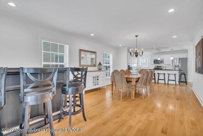 Chandelier, Dining room, Interior, Kitchen, Pendant Lights, Recessed Lighting, Stainless Steel Appliances, Wood Texture Flooring