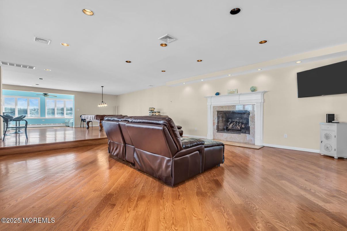 Dining room, Fireplace, Interior, Living room, Pendant Lights, Recessed Lighting, Wood Texture Flooring