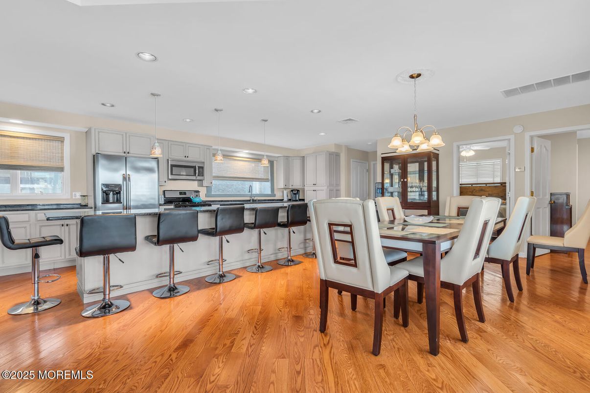Dining room, Interior, Kitchen, Pendant Lights, Recessed Lighting, Stainless Steel Appliances, Wood Texture Flooring