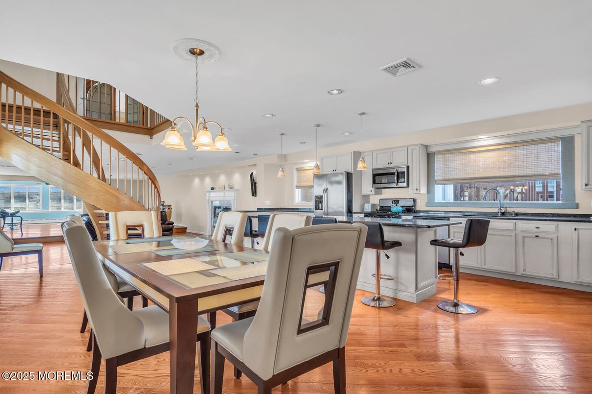 Chandelier, Dining room, Interior, Kitchen, Pendant Lights, Recessed Lighting, Stainless Steel Appliances, Wood Texture Flooring