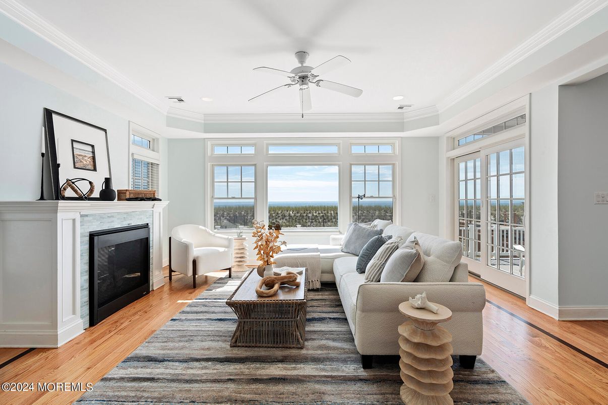 Fireplace, Interior, Living room, Recessed Lighting, Water, Wood Texture Flooring