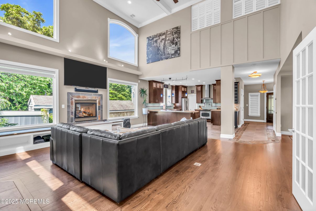 Fireplace, Interior, Kitchen, Living room, Recessed Lighting, Stainless Steel Appliances, Wood Texture Flooring