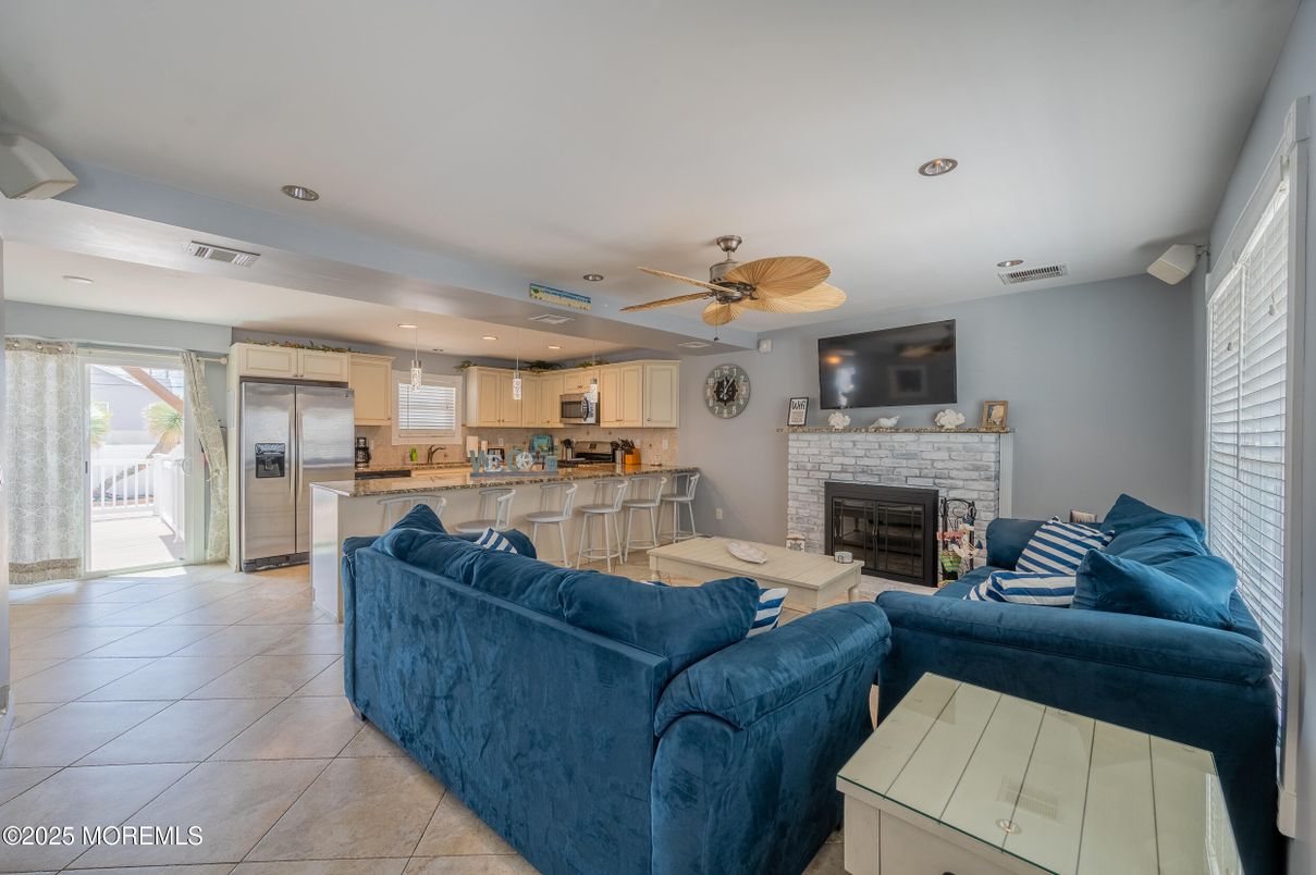 Fireplace, Interior, Kitchen, Living room, Recessed Lighting, Stainless Steel Appliances