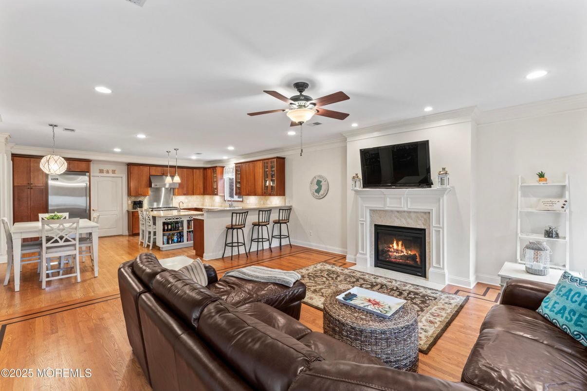Dining room, Fireplace, Interior, Kitchen, Living room, Pendant Lights, Recessed Lighting, Stainless Steel Appliances, Wood Texture Flooring