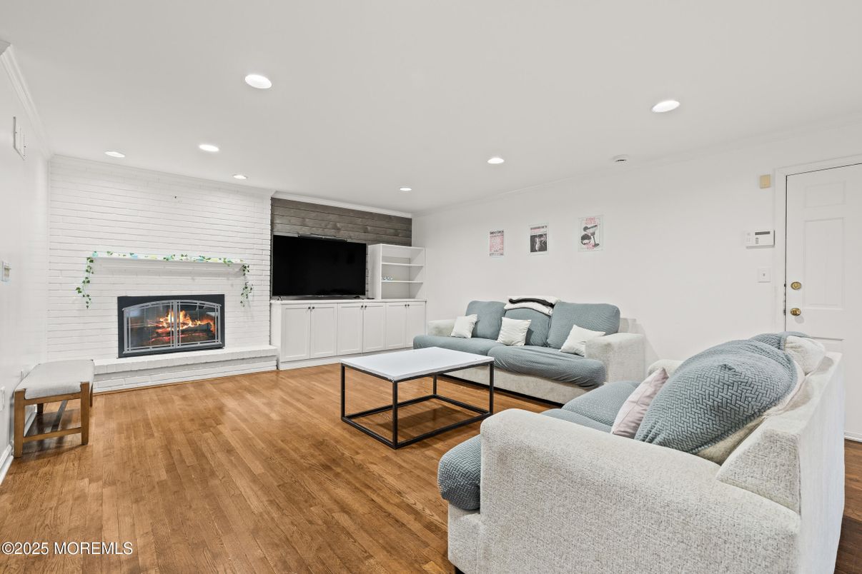 Fireplace, Interior, Living room, Recessed Lighting, Stone Walls, Wood Texture Flooring