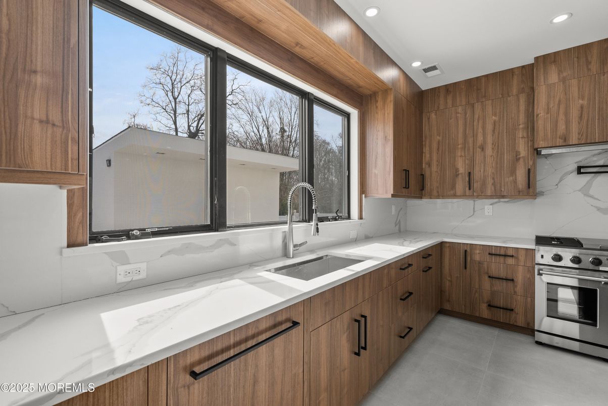 Interior, Kitchen, Marble Walls, Recessed Lighting, Stainless Steel Appliances