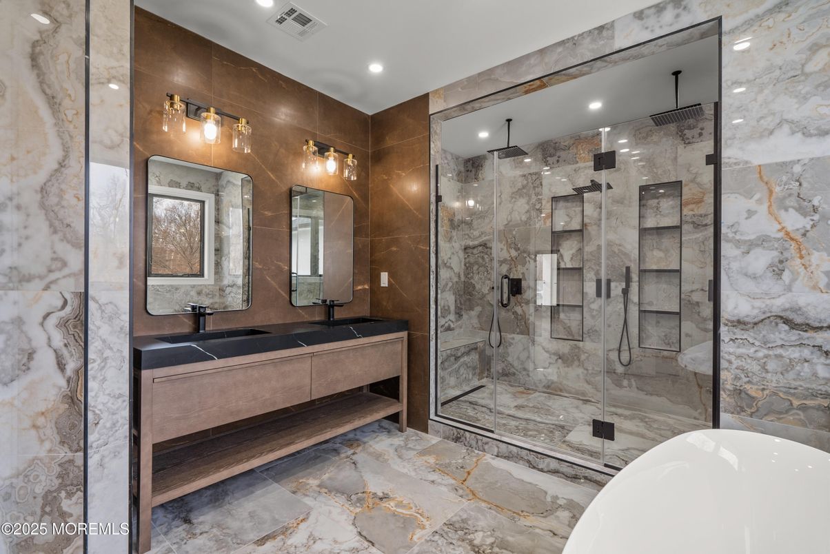 Bathroom, Dual Sink Vanities, Free Standing Baths, Glass Shower, Interior, Marble Walls, Recessed Lighting