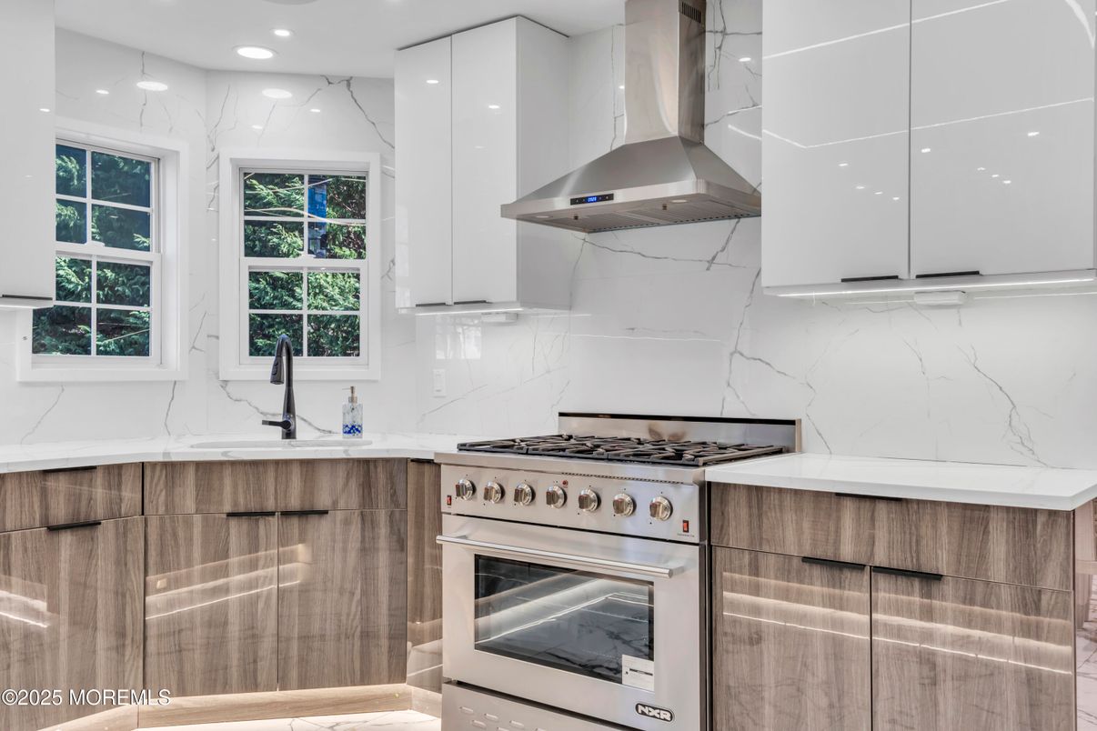 Interior, Kitchen, Marble Walls, Recessed Lighting, Stainless Steel Appliances