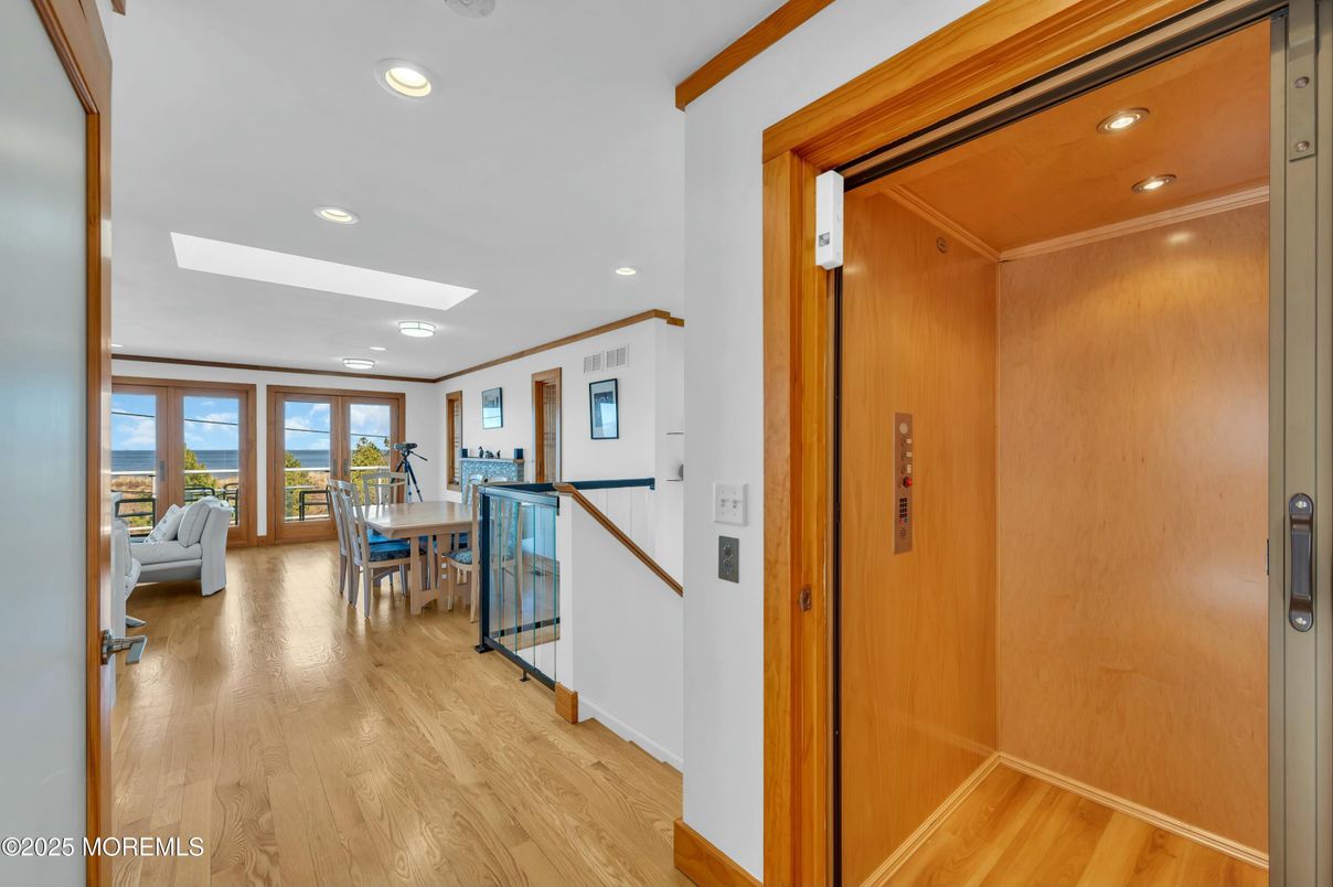 Dining room, Elevator, Interior, Recessed Lighting, Wood Texture Flooring, Wooden Walls