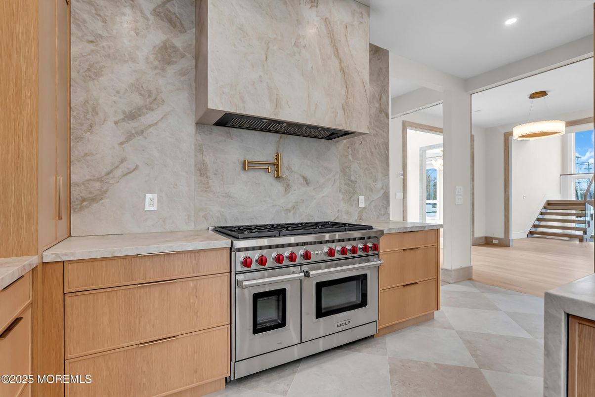 Interior, Kitchen, Marble Walls, Pendant Lights, Recessed Lighting, Stainless Steel Appliances