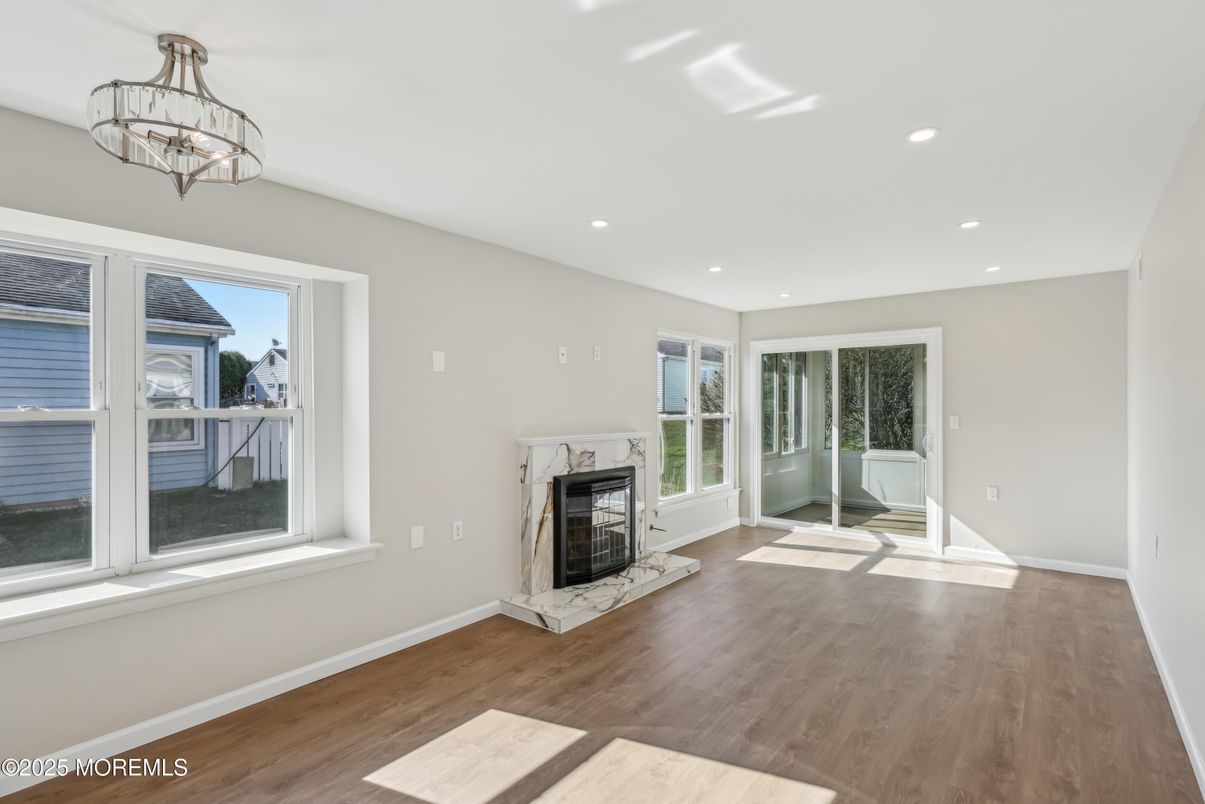 Chandelier, Empty room, Fireplace, Interior, Recessed Lighting, Wood Texture Flooring