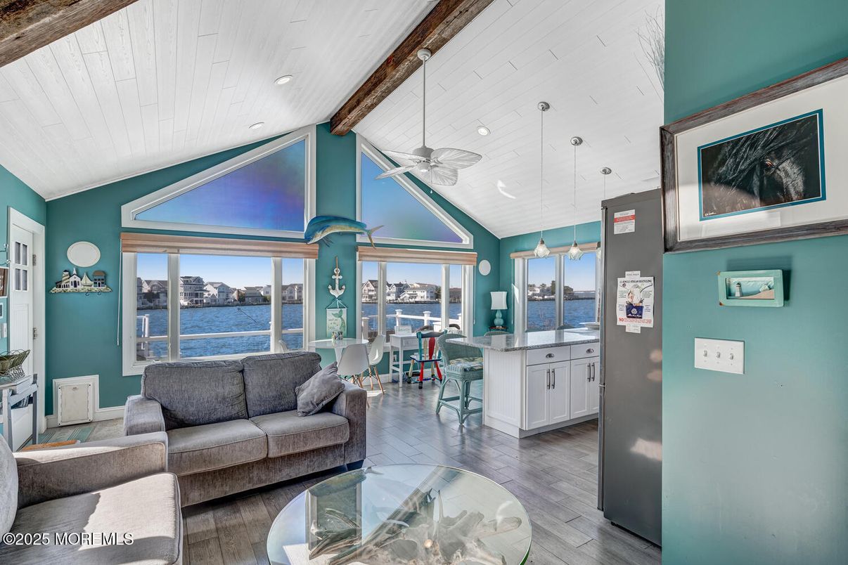 Dining room, Interior, Living room, Pendant Lights, Recessed Lighting, Water, Wooden Beams, Wood Texture Flooring