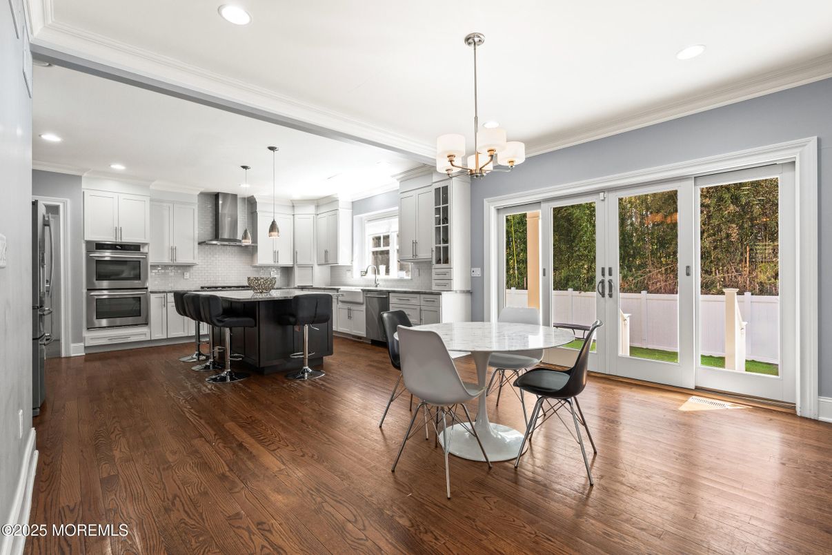 Chandelier, Dining room, Interior, Kitchen, Pendant Lights, Recessed Lighting, Stainless Steel Appliances, Wood Texture Flooring