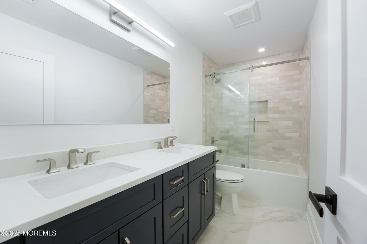 Bathroom, Dual Sink Vanities, Glass Shower, Interior, Marble, Recessed Lighting