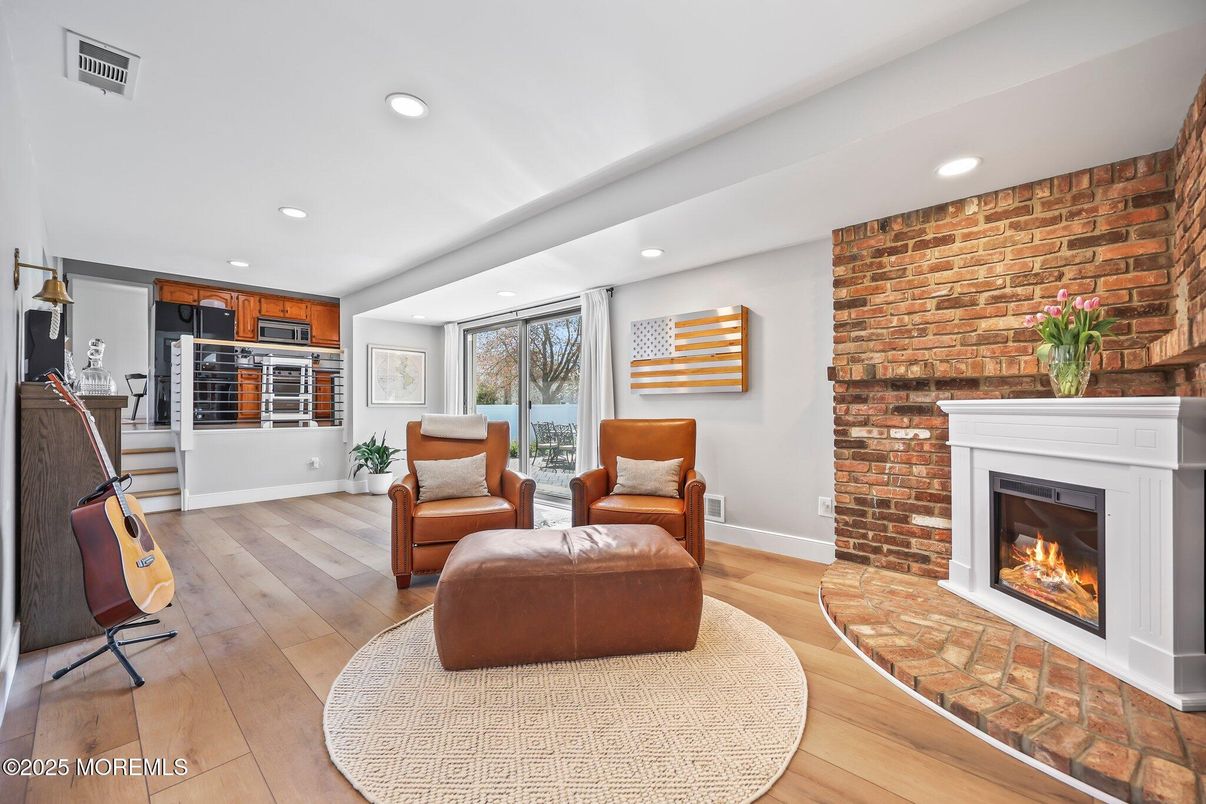 Fireplace, Interior, Kitchen, Living room, Piano, Recessed Lighting, Stone Walls, Wood Texture Flooring