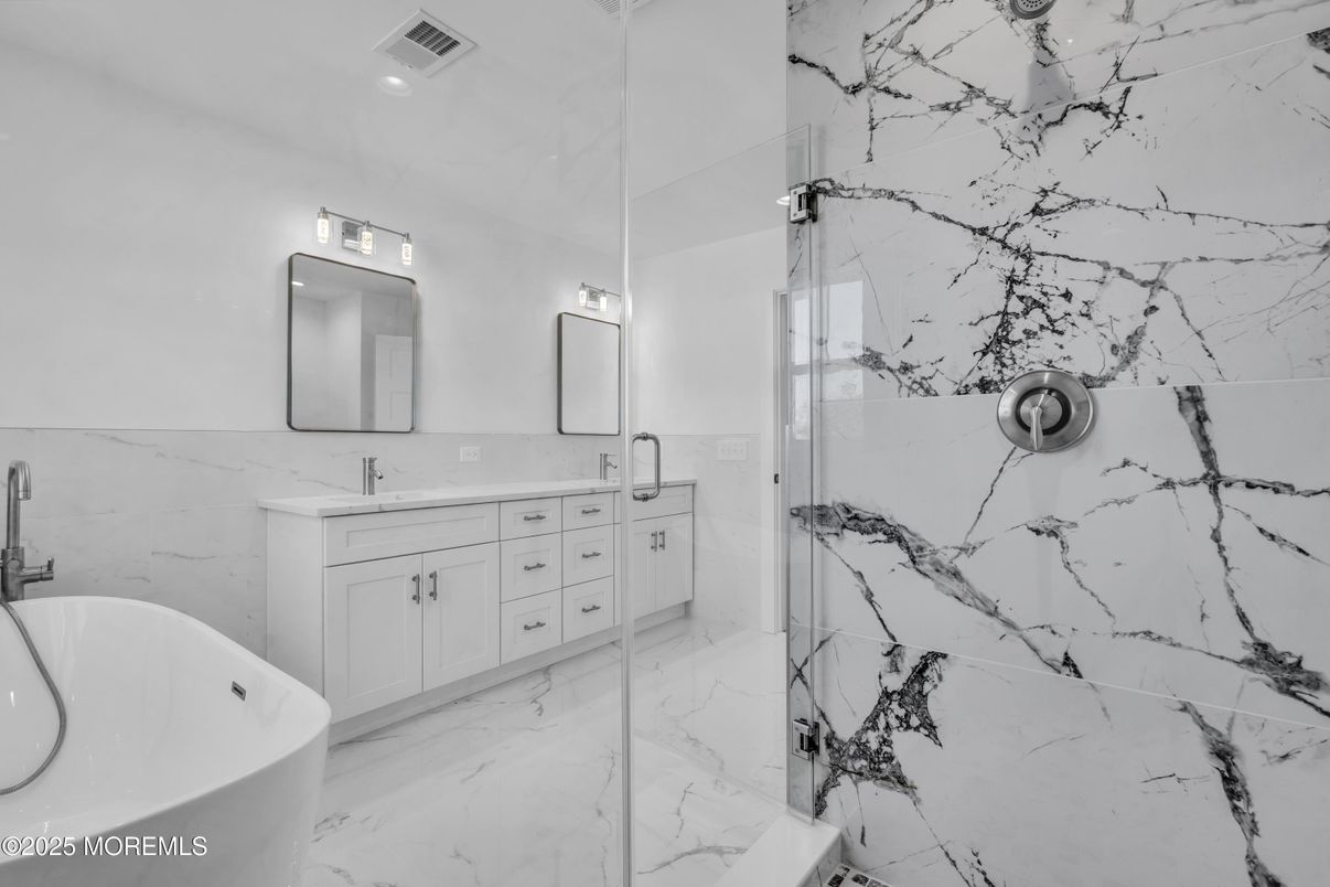 Bathroom, Dual Sink Vanities, Glass Shower, Interior, Marble, Marble Walls, Recessed Lighting