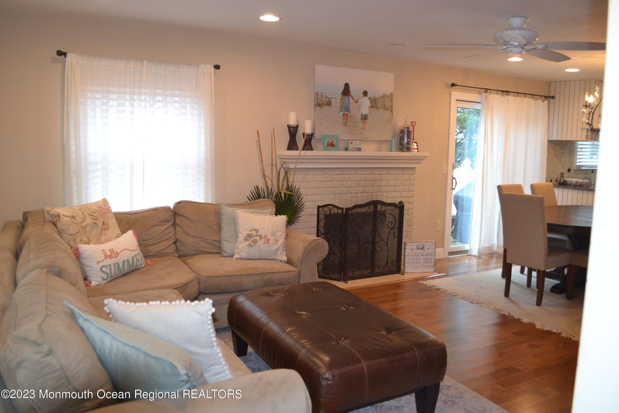 Dining room, Fireplace, Interior, Living room, Recessed Lighting, Wood Texture Flooring