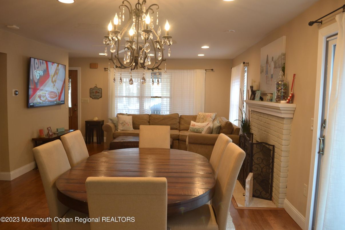 Chandelier, Dining room, Fireplace, Interior, Living room, Recessed Lighting, Wood Texture Flooring