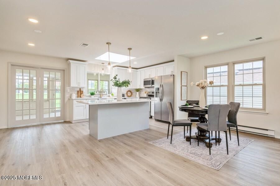 Dining room, Interior, Kitchen, Pendant Lights, Recessed Lighting, Stainless Steel Appliances, Wood Texture Flooring