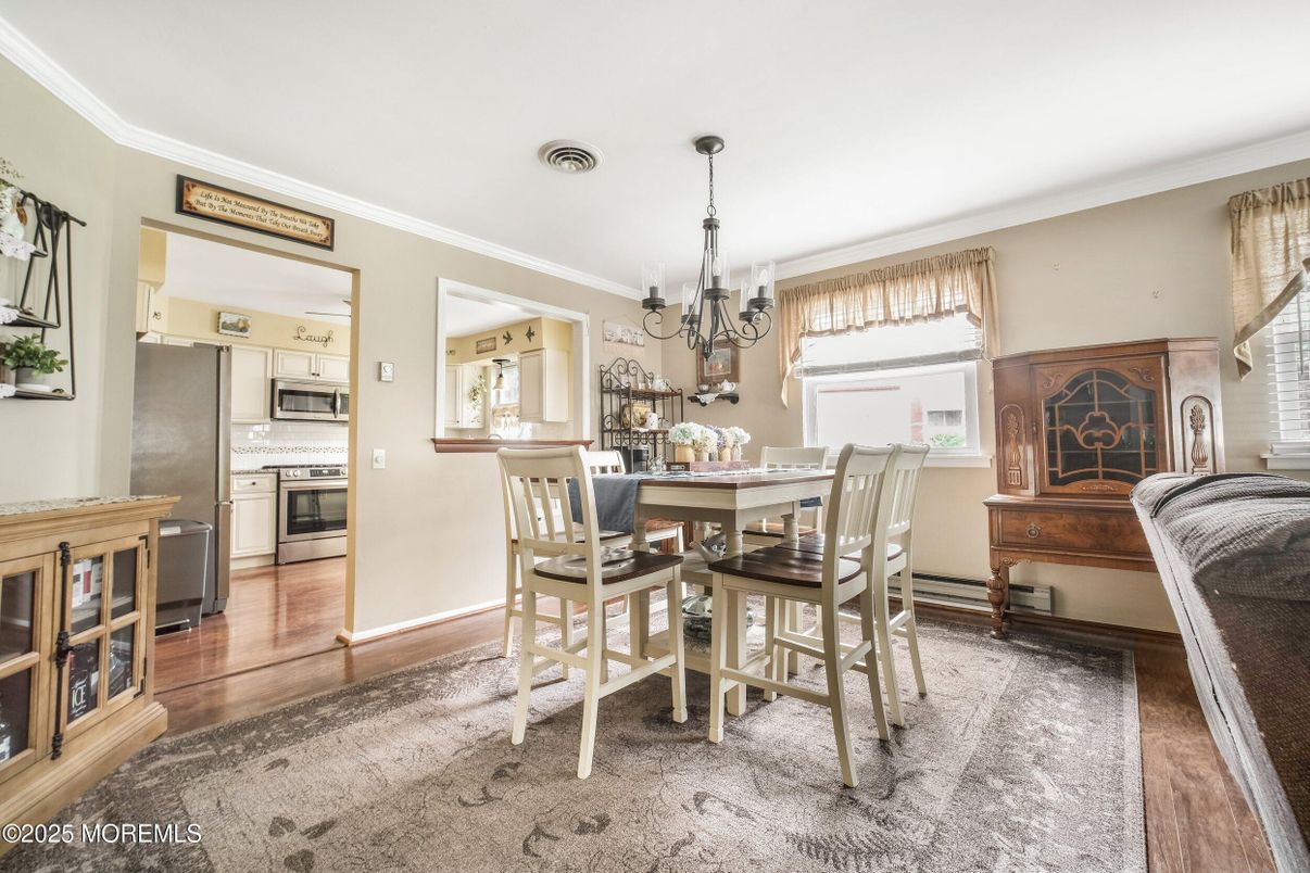 Chandelier, Dining room, Interior, Kitchen, Stainless Steel Appliances, Wood Texture Flooring
