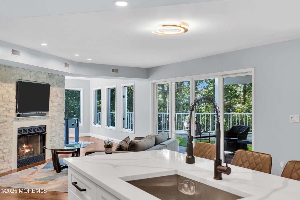 Fireplace, Interior, Living room, Piano, Recessed Lighting, Stone Walls, Wood Texture Flooring