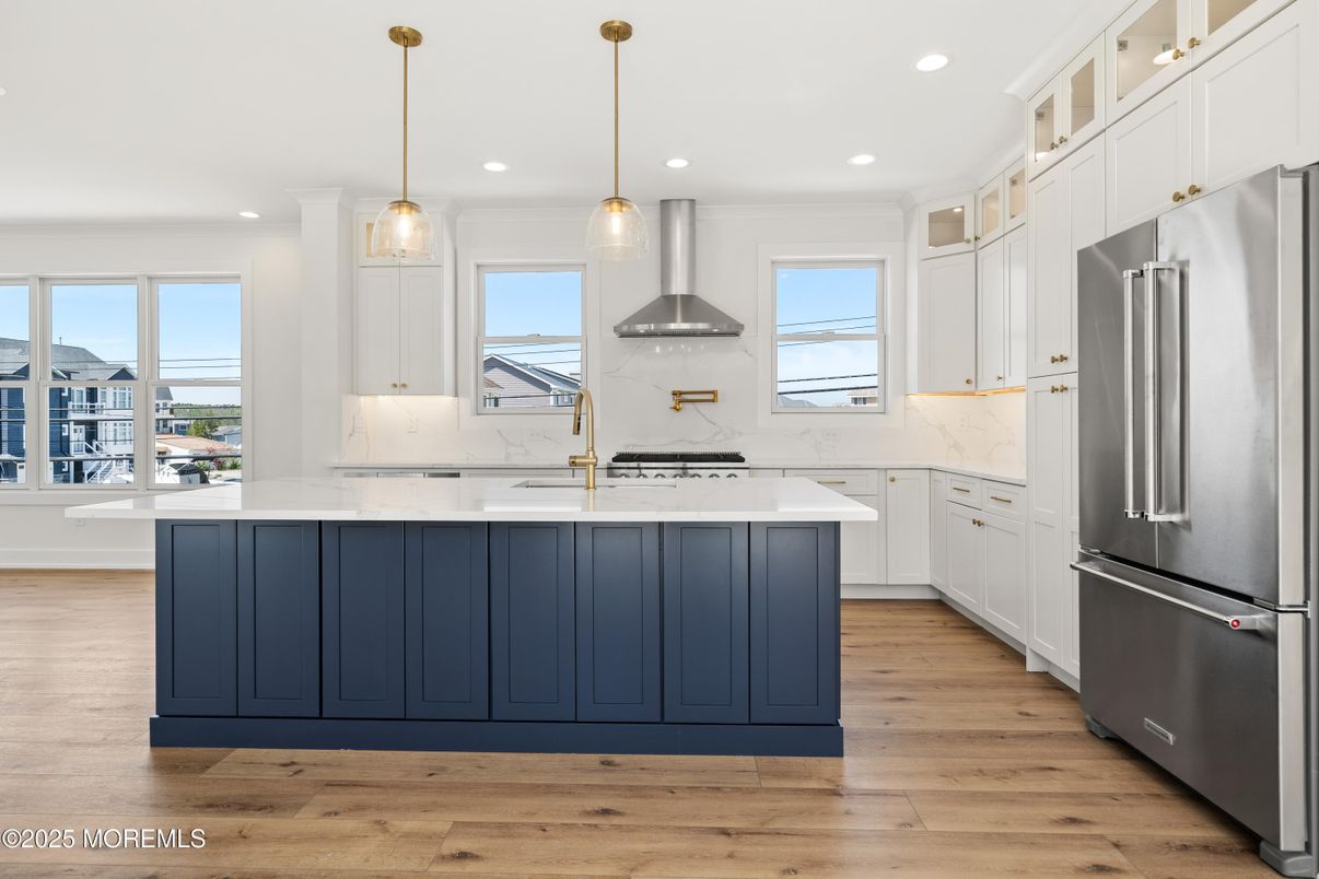 Interior, Kitchen, Marble Walls, Pendant Lights, Recessed Lighting, Stainless Steel Appliances, Wood Texture Flooring