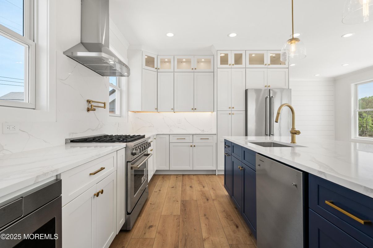 Interior, Kitchen, Marble Walls, Pendant Lights, Recessed Lighting, Stainless Steel Appliances, Wood Texture Flooring