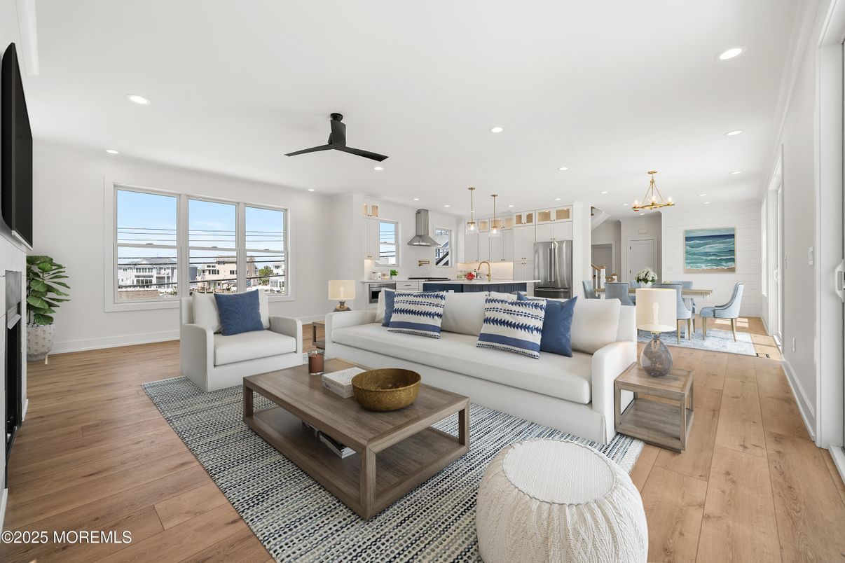 Chandelier, Dining room, Interior, Kitchen, Living room, Pendant Lights, Recessed Lighting, Stainless Steel Appliances, Wood Texture Flooring