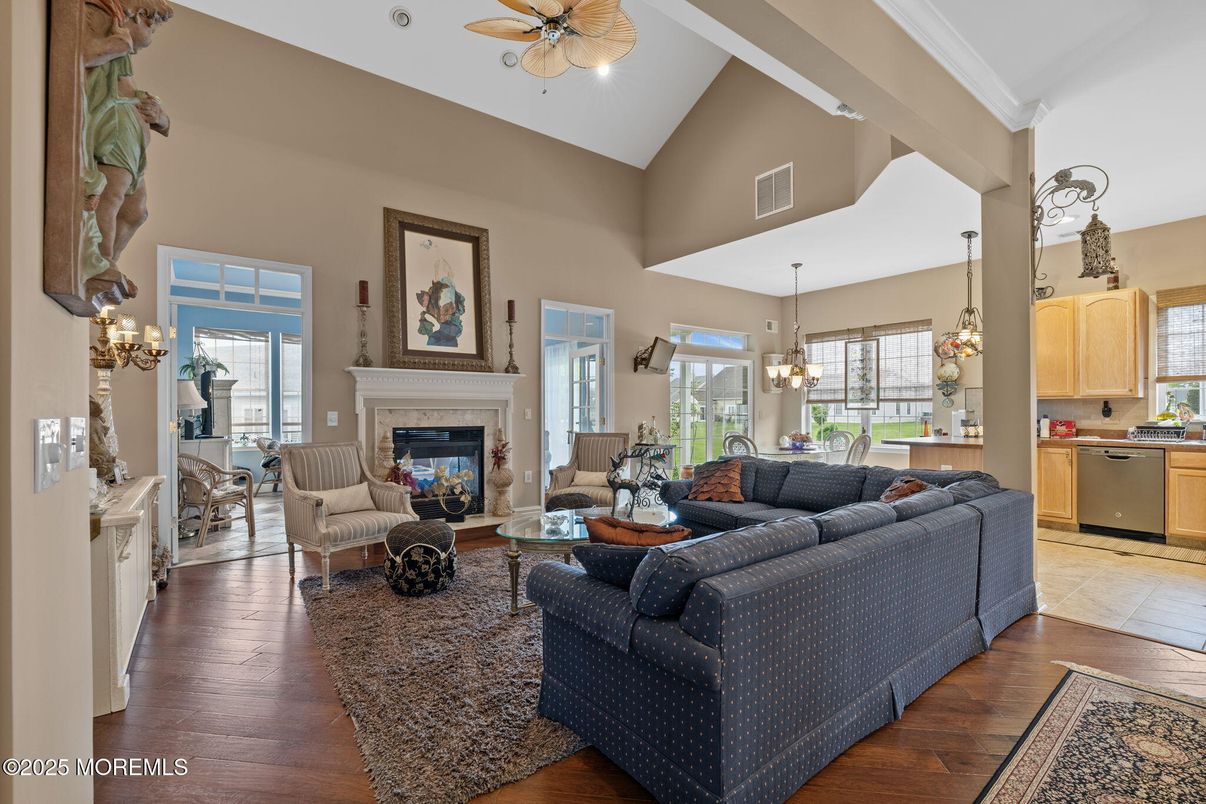 Chandelier, Dining room, Fireplace, Interior, Kitchen, Living room, Pendant Lights, Wood Texture Flooring
