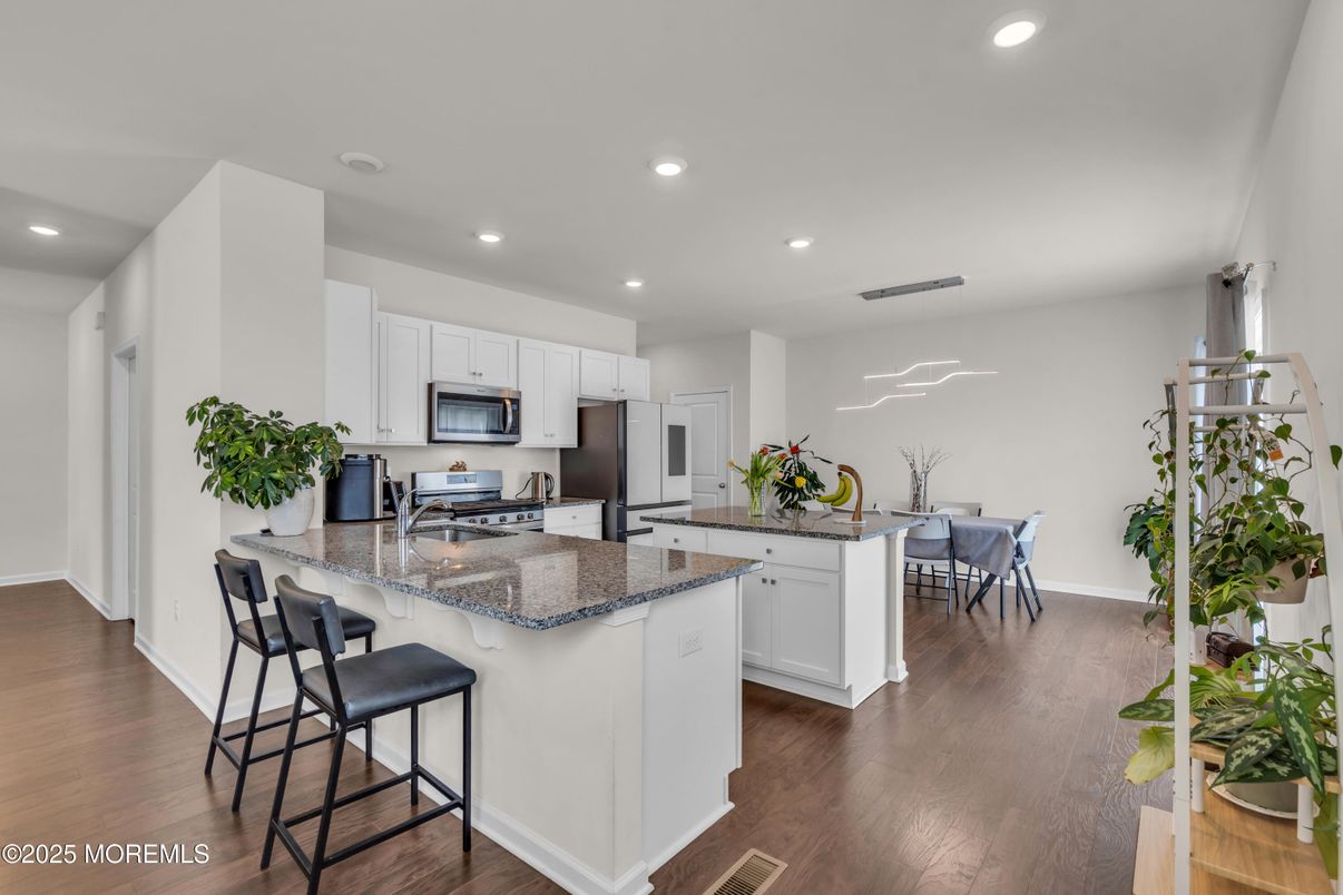 Dining room, Interior, Kitchen, Recessed Lighting, Stainless Steel Appliances, Wood Texture Flooring