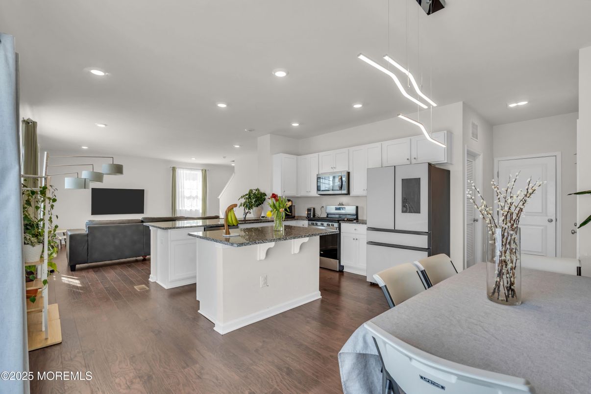 Dining room, Interior, Kitchen, Pendant Lights, Recessed Lighting, Stainless Steel Appliances, Wood Texture Flooring